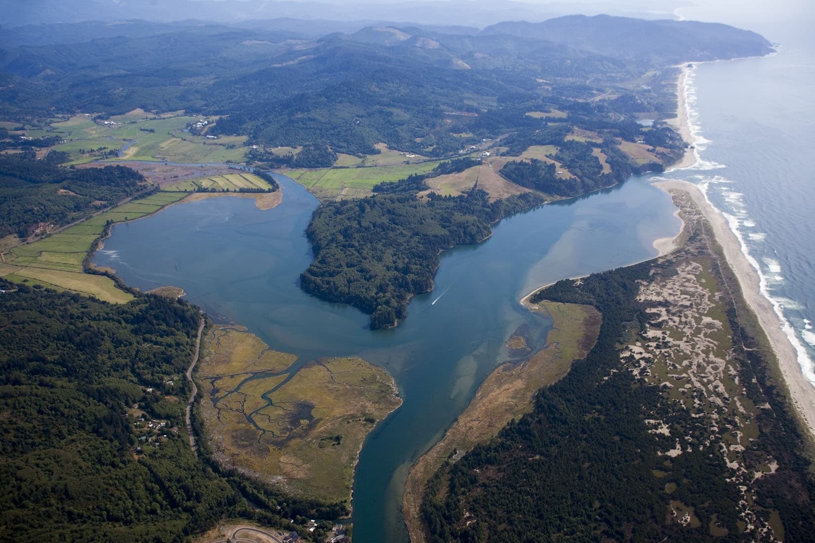 An aerial view looking south towards Cannery Hill in the center shows Nestucca Bay National Wildlife Refuge in Oregon.