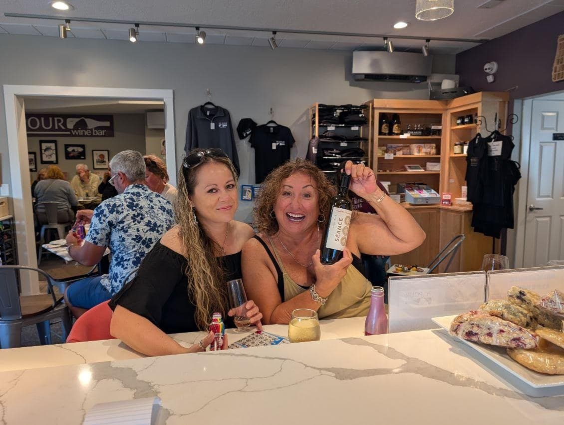 Two happy attendees at a PC Pour event