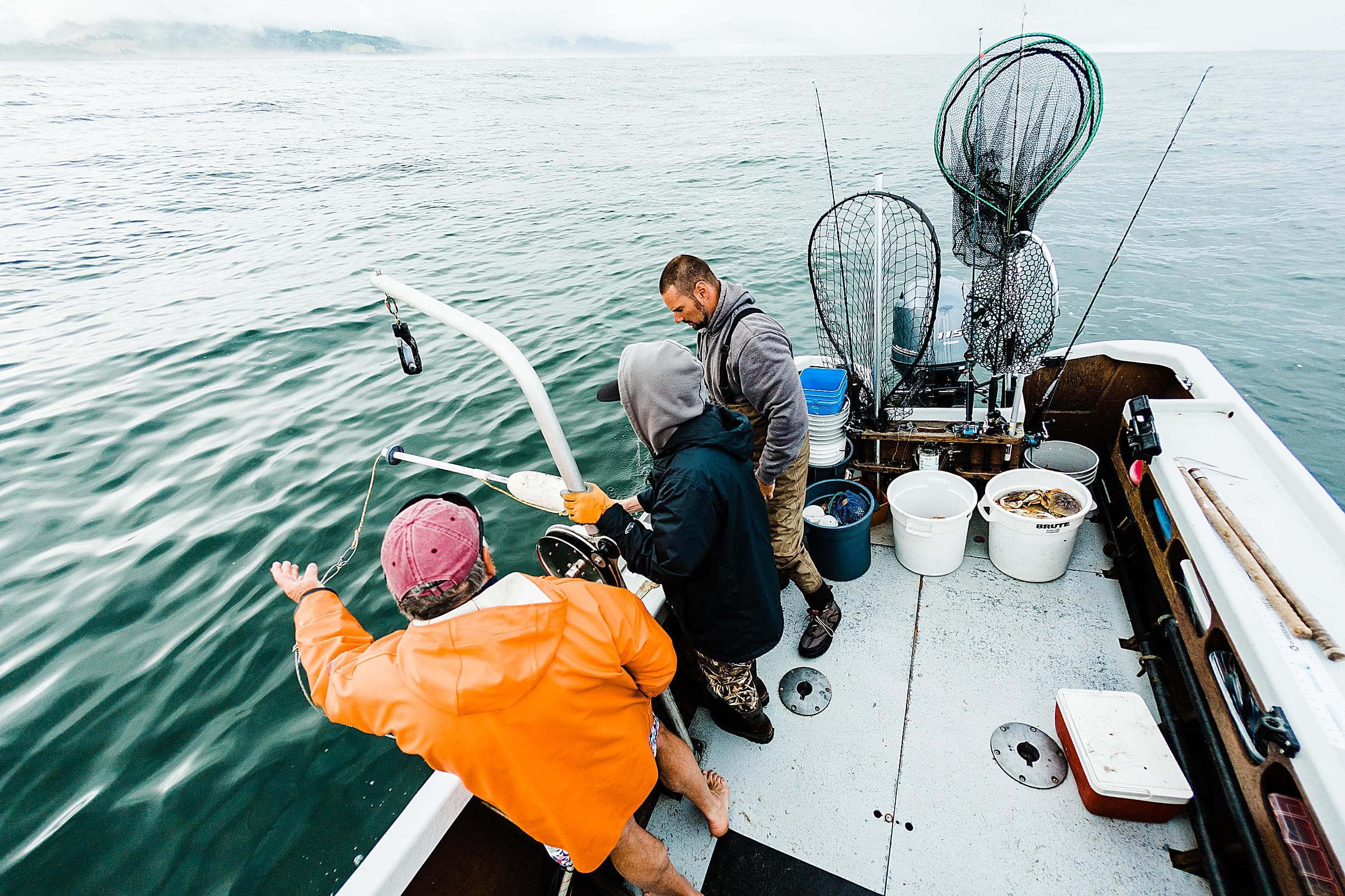 Crabbing charter boat with fresh Dungeness crab on the Pacific Ocean near Pacific City, Oregon — Inn at Cape Kiwanda guest activity.