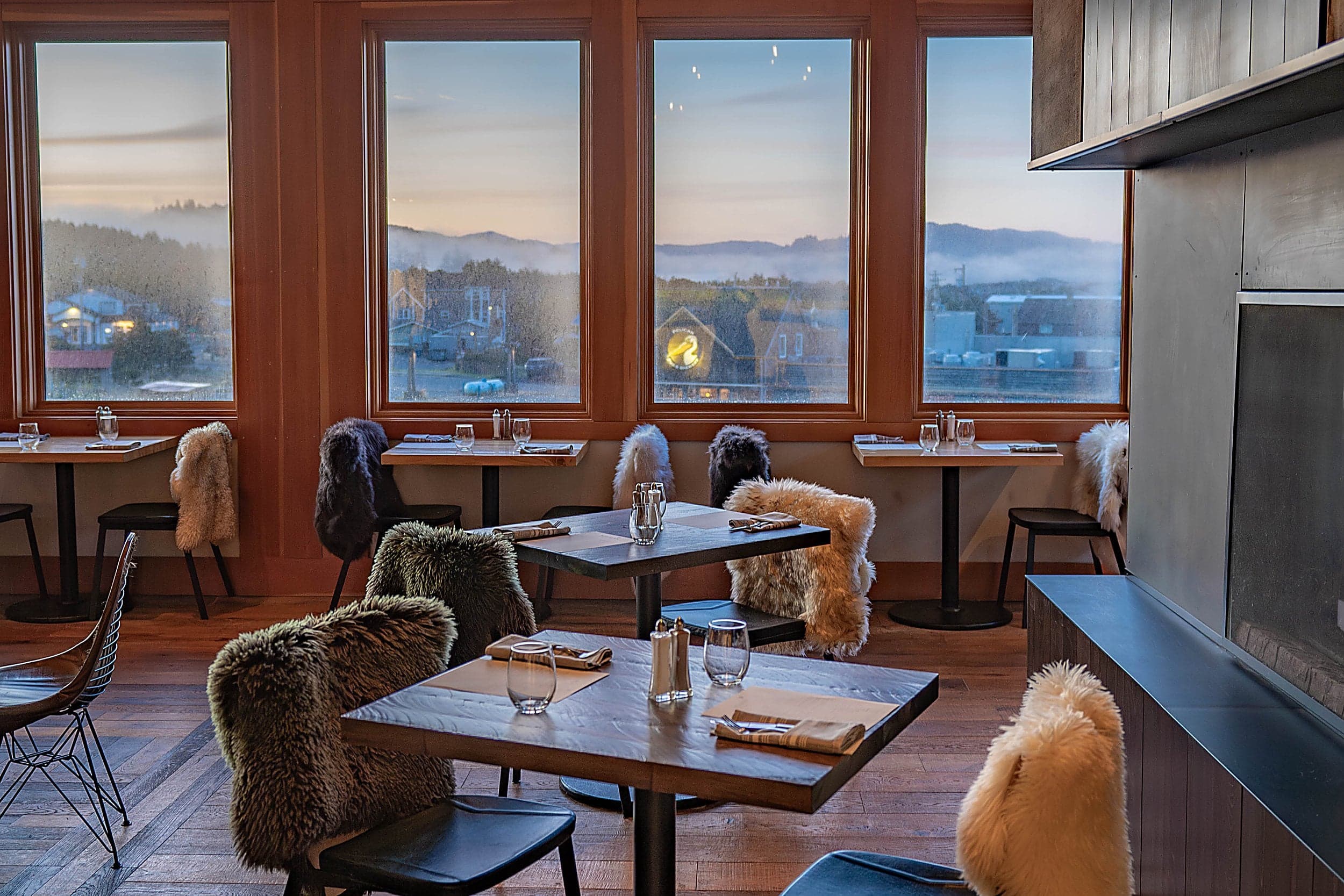 Meridian restaurant dining room at sunset with coastal views, Inn at Cape Kiwanda, Pacific City, Oregon Coast