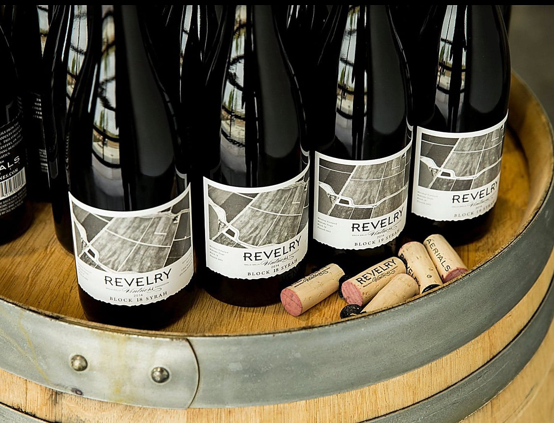 Revelry Vintners Syrah bottles on a wine barrel at the Inn at Cape Kiwanda, Pacific City, Oregon Coast