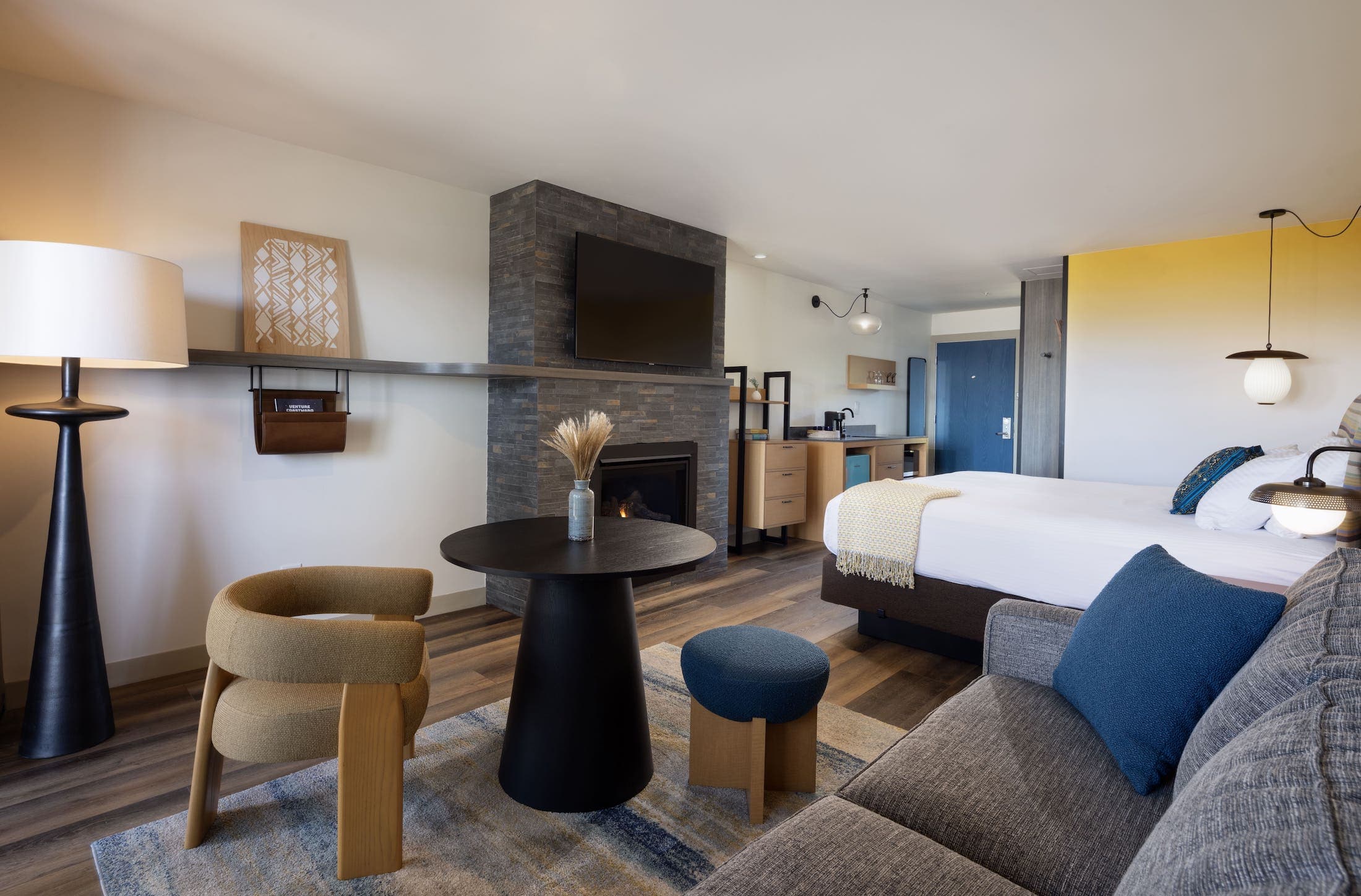 Inn At Cape Kiwanda Signature King with a fireplace, and open concept living space