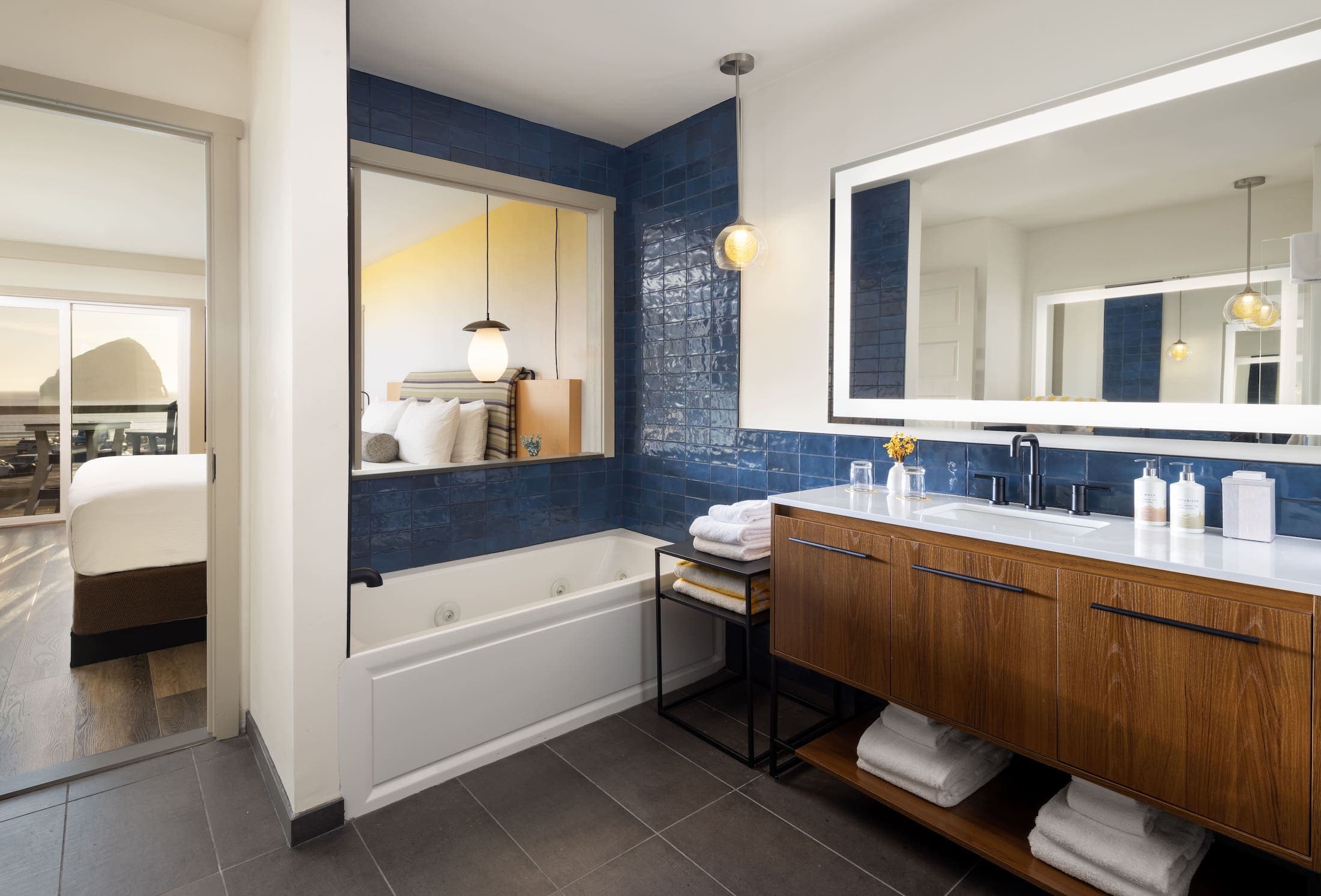 Inn At Cape Kiwanda Top Floor King Jetted Tub Bathroom with a jetted tub, large vanity and mirror