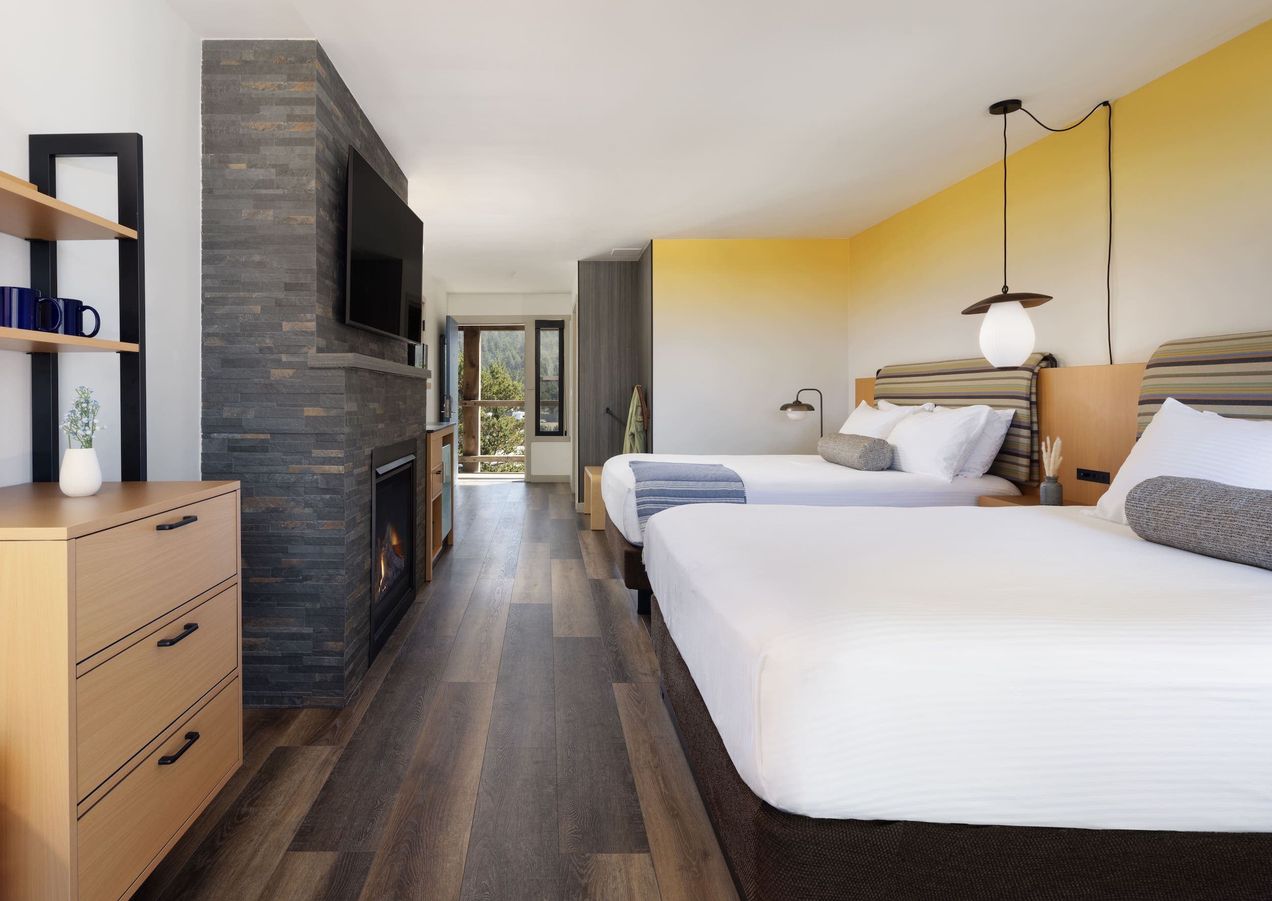 Inn At Cape Kiwanda Top Floor Two Queens Accessible Room with 2 queen beds, fireplace, dresser, and a kitchenette