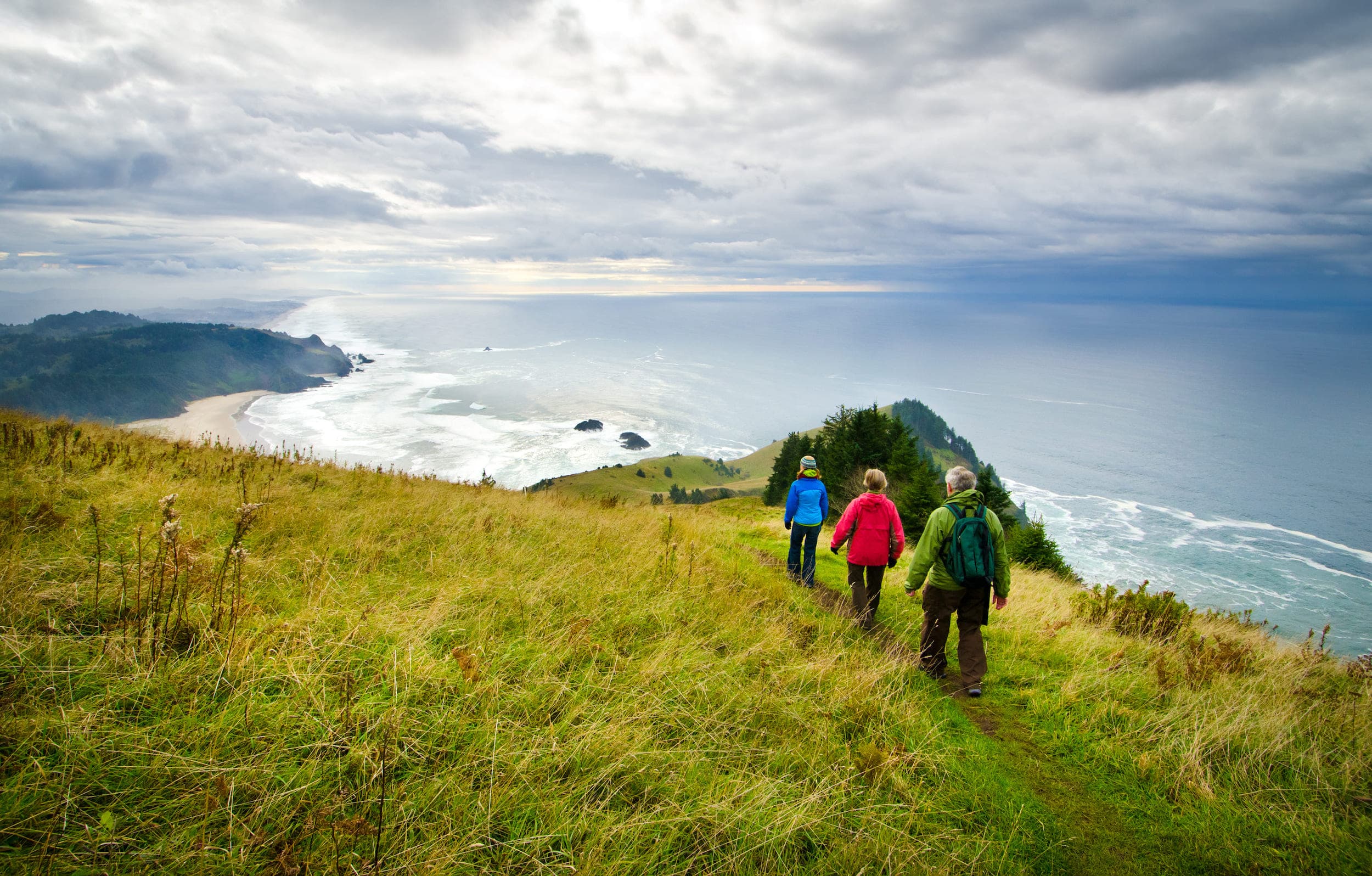 Three people walking Lower Cascade Head Gods