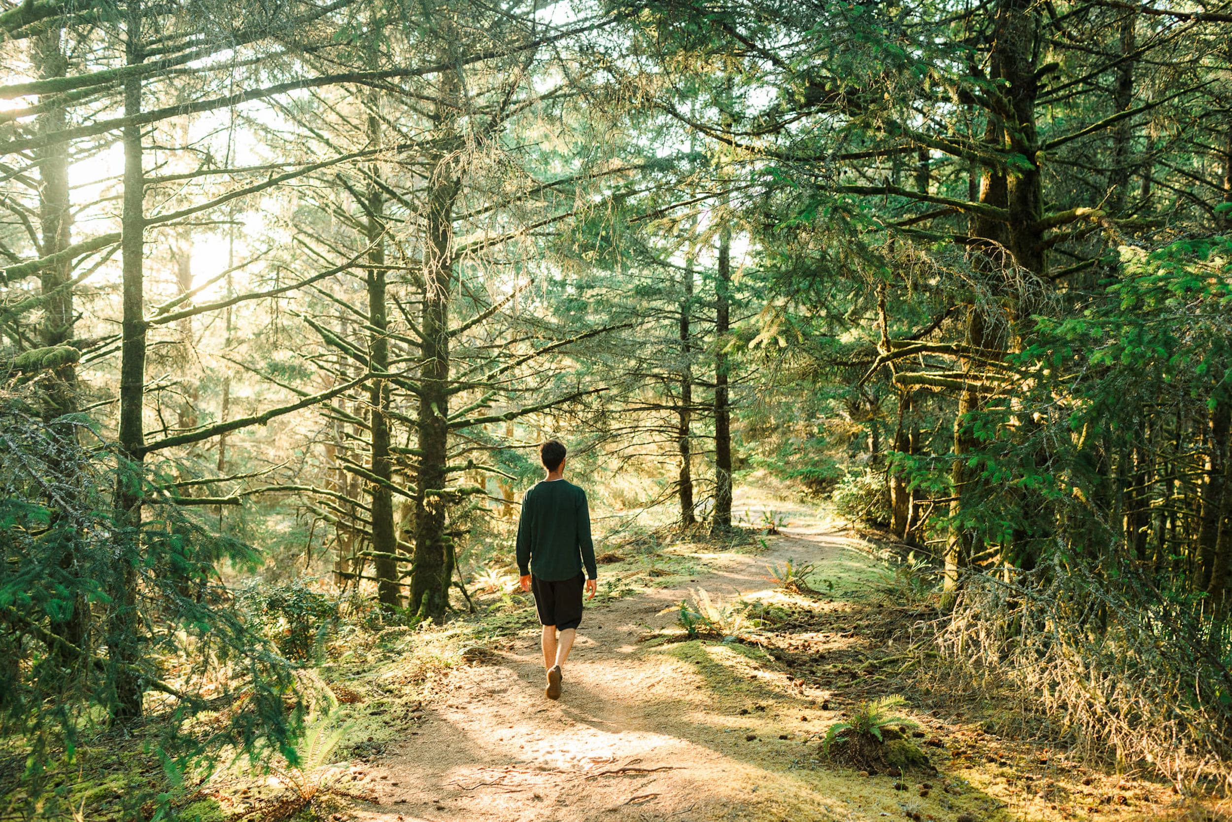 A person walking a Pacific City Pathways Trail