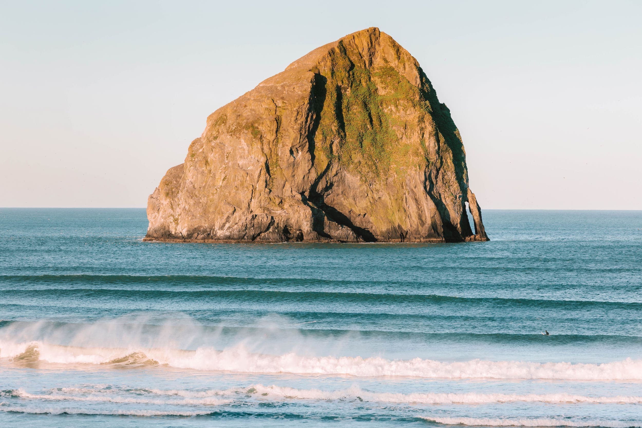 A view of the ocean from the beach shore on a beautiful day at Inn at Cape Kiwanda