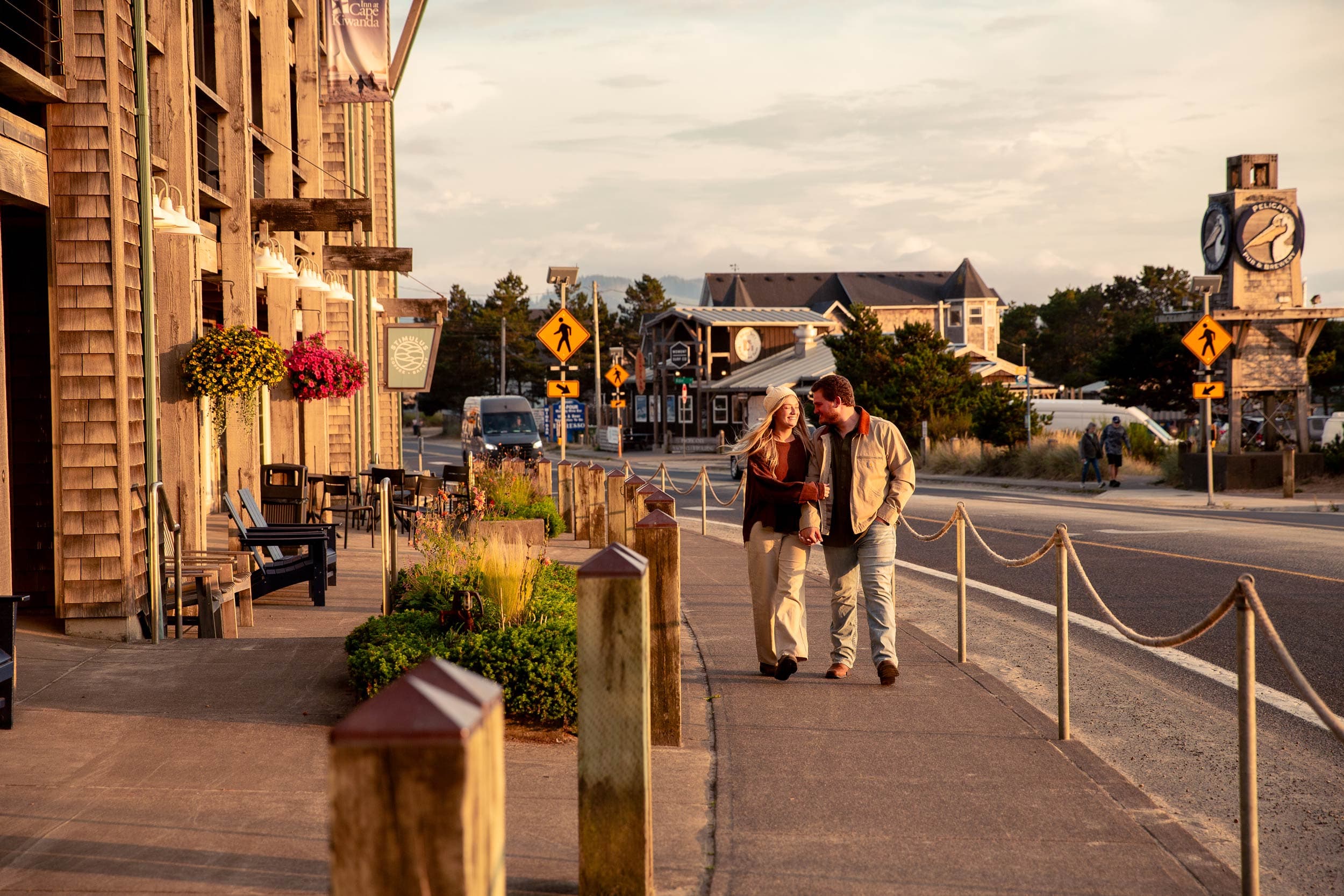 Couple Walking In Oregon By The Beach