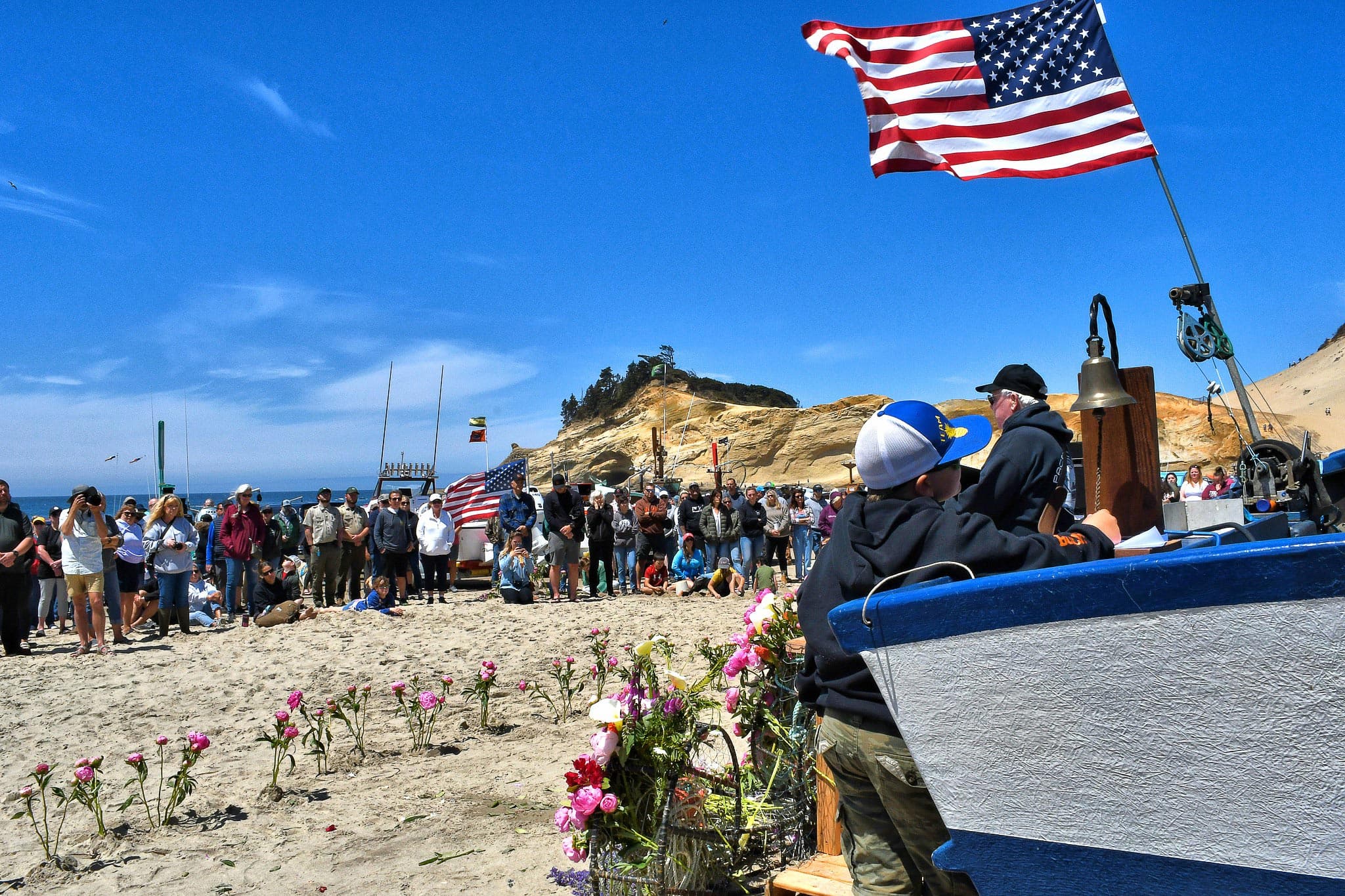 Crowd Gathered Around A Boat