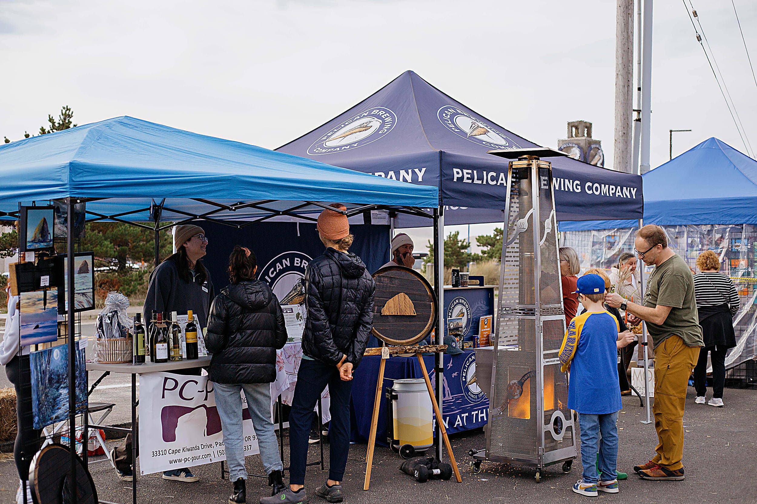 Guests visiting Pelican Brewing Company and PC-Pour wine tents at the Fall Festival near the Inn at Cape Kiwanda, Pacific City, Oregon Coast